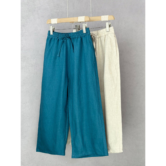 Casual linen pants for women with elastic waist and side pockets with openings.