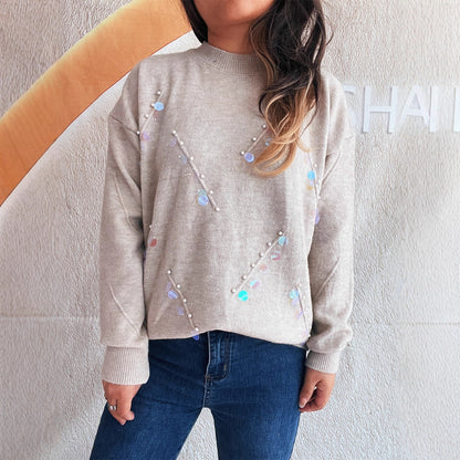 Pull femme avec des détails en perles et en strass à la mode Chic und Stil