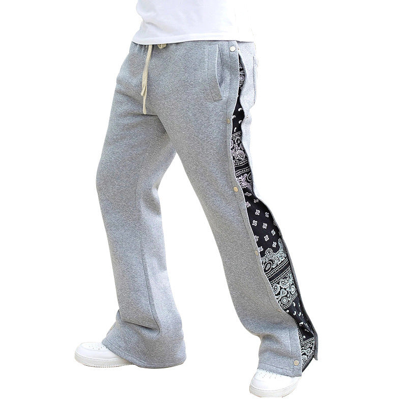 Casual men's jogger pants with side snap button closure and trendy mix of patterns Chic und Stil