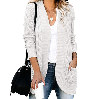 Veste en tricot pour femmes avec un motif de tricot moderne et des poches pratiques Chic und Stil