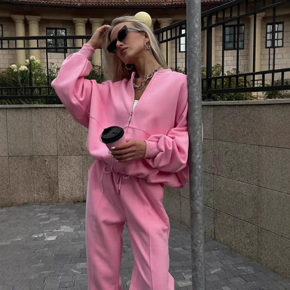 Trendy cropped sports set for women with a loose top and chic elastic pants.