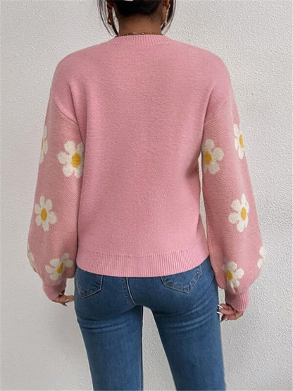 Pull en tricot pour femmes avec un motif floral ludique et des manches bouffantes élégantes Chic und Stil