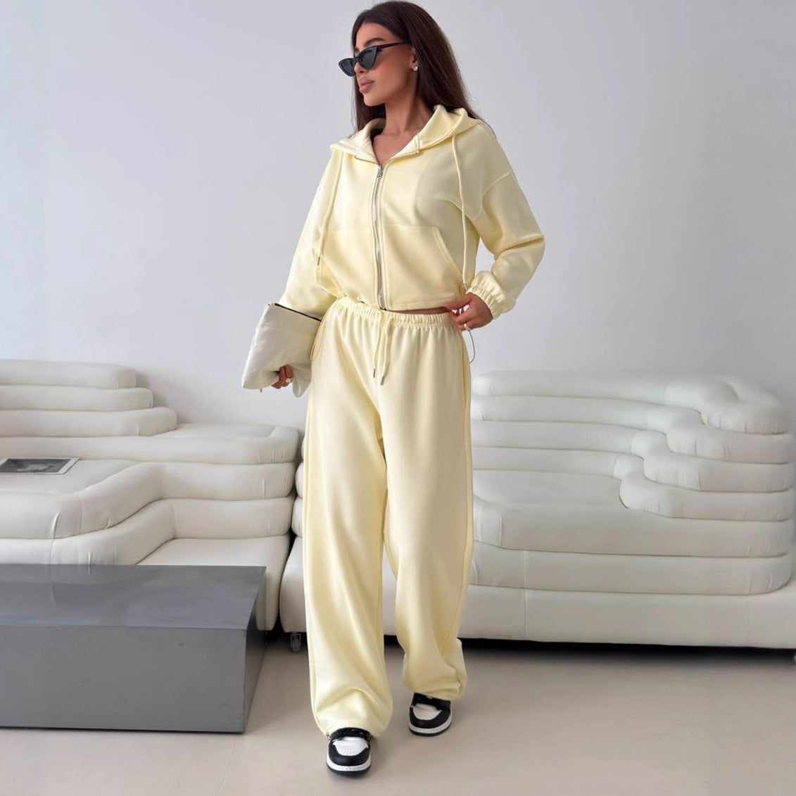 Fashionable women's hoodie with a short cut and matching jogger pants Chic and Style