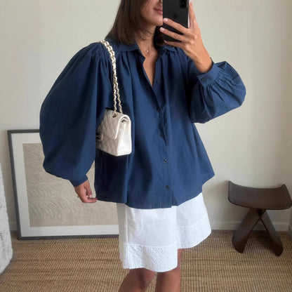 Woman casual outfit combined with loose blouse and shorts Chic and Style