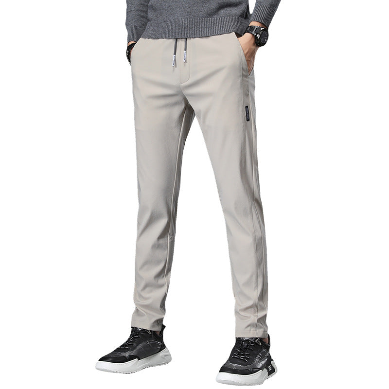 Men's slim fit sports pants with elastic waistband and practical zip pockets Chic and Style