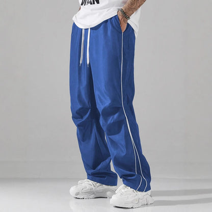 Men's sports pants with elastic waistband and contrasting stripes Chic and Style