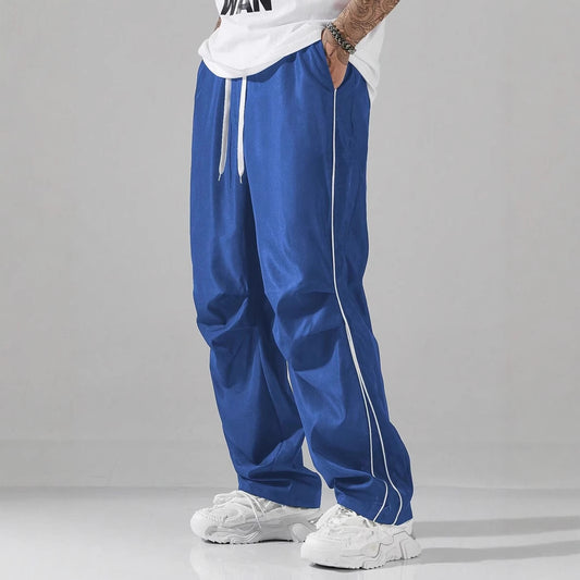 Men's sports pants with elastic waistband and contrasting stripes Chic and Style