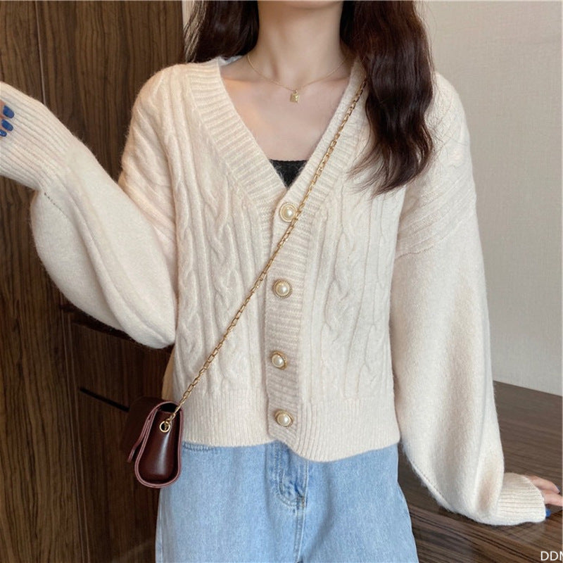Knitted jacket for women with an elegant braid pattern and high-quality button details Chic and Style