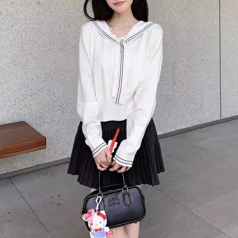 Pull femme élégant avec col à nœud et fine structure en tricot Chic und Stil