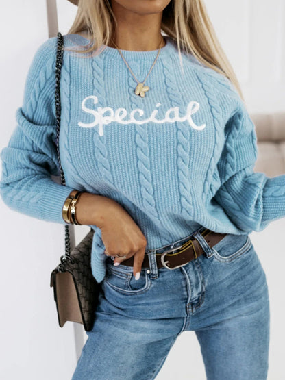 Pull en tricot pour dames avec motif torsadé et inscription brodée Chic und Stil