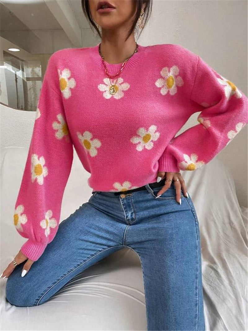 Pull en tricot pour femmes avec un motif floral ludique et des manches bouffantes élégantes Chic und Stil