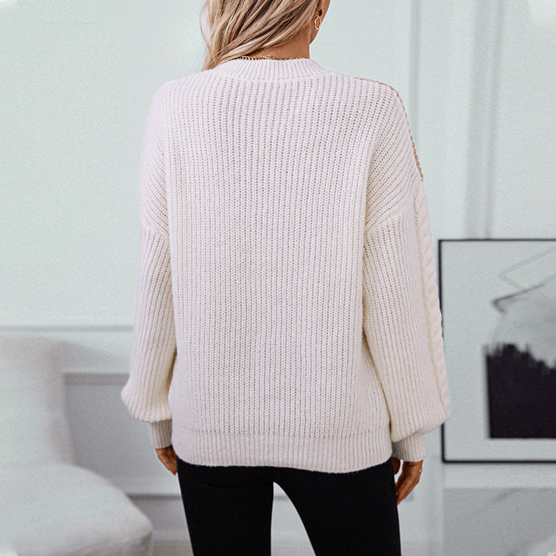 Pull en maille tendance pour femmes avec des manches à motif torsadé raffiné et des couleurs contrastées Chic und Stil