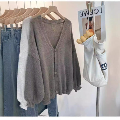 Ladies Cozy Knit Pullover with Voluminous Sleeves and Button Details Chic und Stil