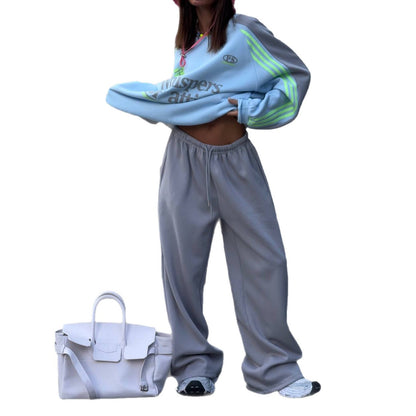 Ladies Casual Sports Outfit with a Relaxed Sweatshirt and Comfortable Jogging Pants Chic and Style