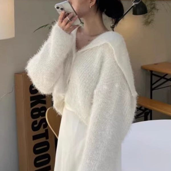 Pull décontracté pour femmes avec décolleté en V profond et motif de mailles texturé Chic und Stil