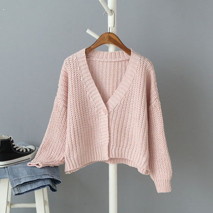 Cardigan court en tricot pour femme avec décolleté en V et détails de boutons tendance Chic und Stil