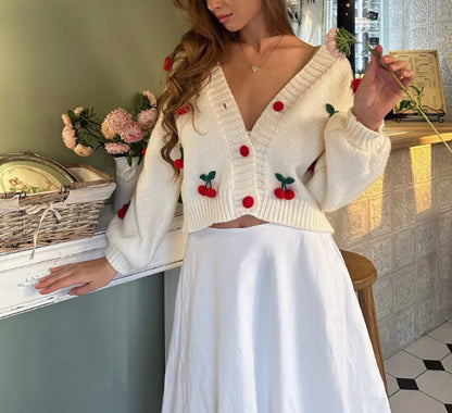 Dame cardigan avec design floral brodé et bord côtelé Chic und Stil