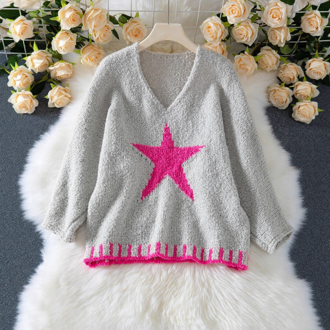 Pull en tricot femme avec col en V et motif étoilé frappant Chic und Stil