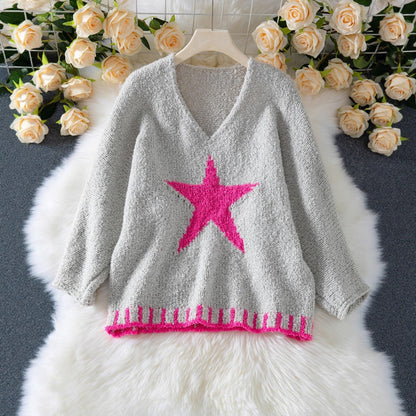 Pull en tricot femme avec col en V et motif étoilé frappant Chic und Stil