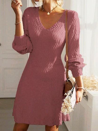 Robe portefeuille pour femmes avec motif structuré et décolleté en V Chic und Stil
