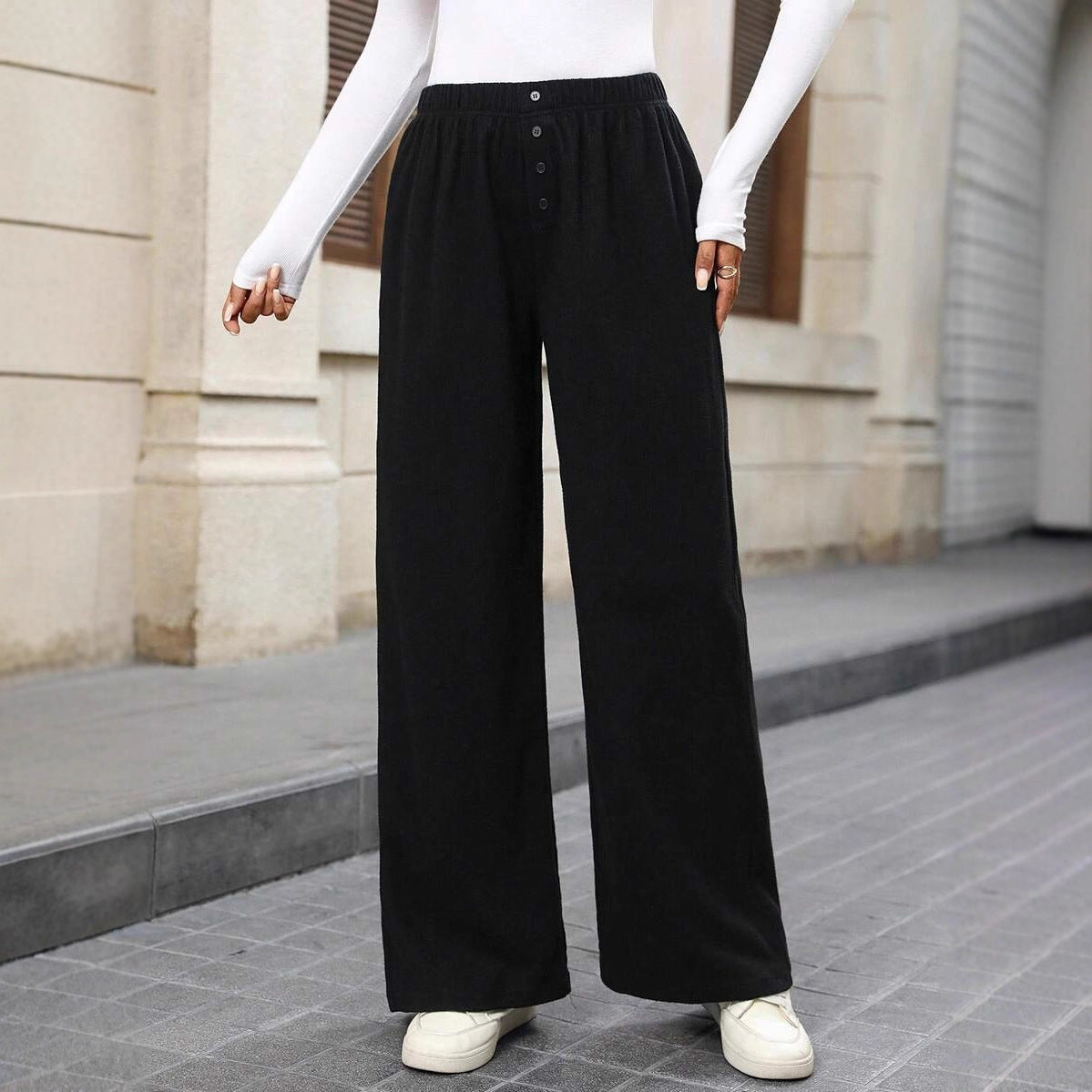 Loose fabric pants for women with a button row and elastic waist Chic and Style
