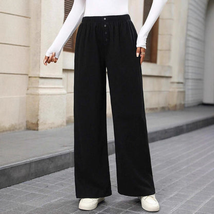 Loose fabric pants for women with a button row and elastic waist Chic and Style
