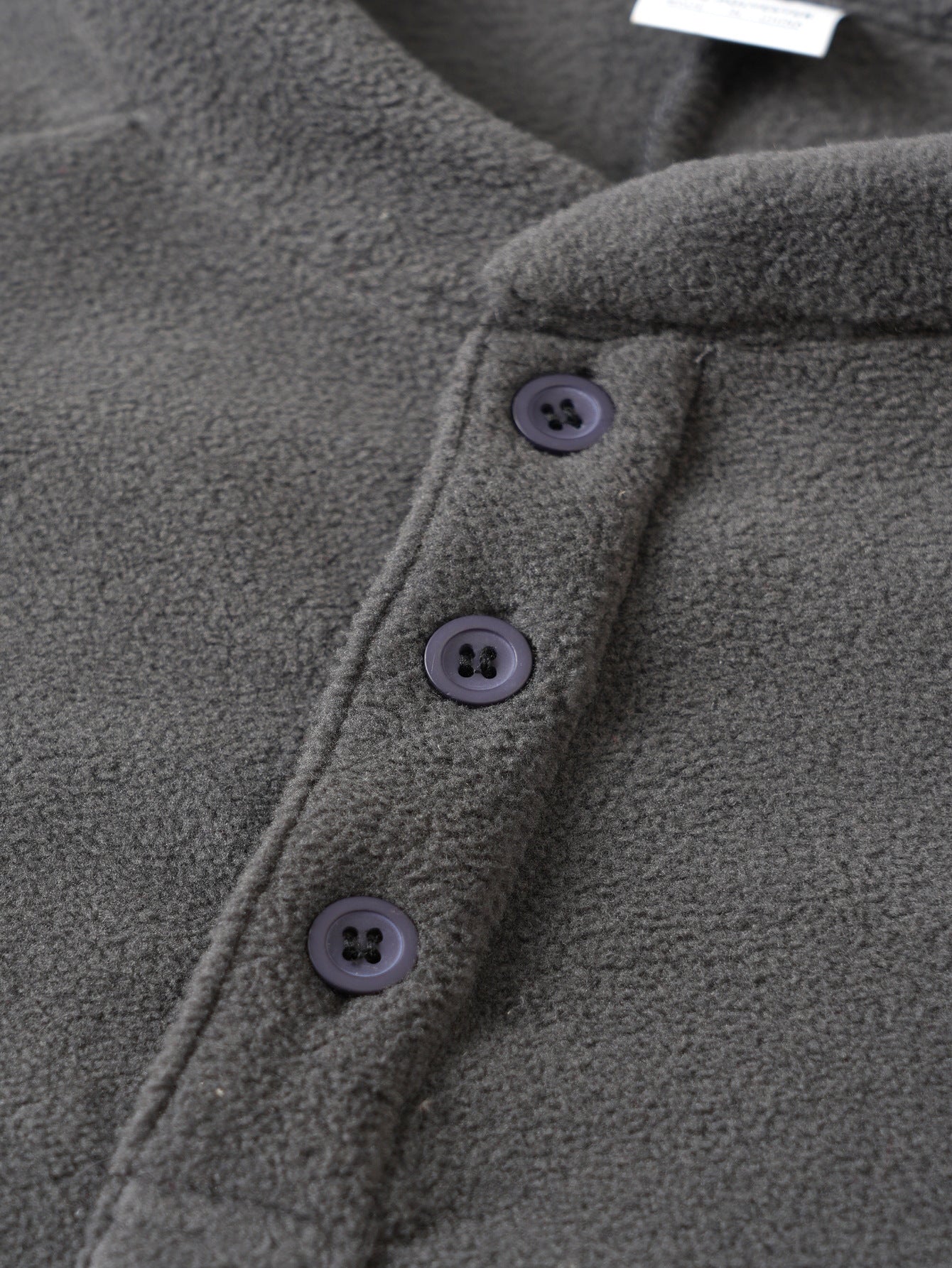 Men's fleece pullover with trendy high collar and practical button details Chic and Style