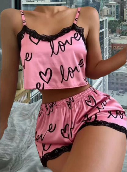 Chic and Style women's satin crop top and shorts set with hearts and lace accents