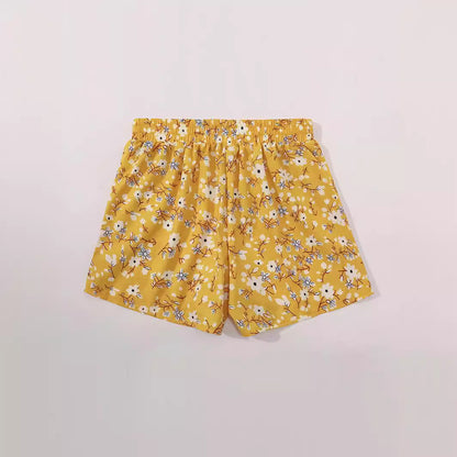 Shorts fleuris pour femmes avec taille élastique et poches latérales Chic und Stil