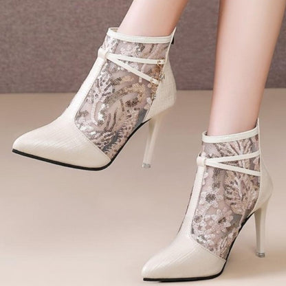 Bottes de cheville élégantes pour dames avec un matériau supérieur transparent et des applications scintillantes Chic und Stil