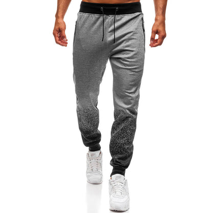 Pantalon de jogging sportif pour hommes avec dégradé de couleurs raffiné et poches à fermeture éclair pratiques Chic und Stil