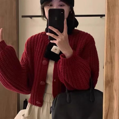 Cardigan en grosse maille pour femmes avec des manches volumineuses et de gros boutons Chic und Stil
