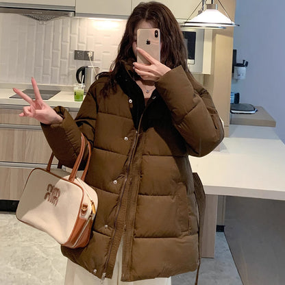 Classic women's down jacket with high collar and practical pockets. Chic and stylish.