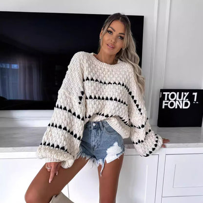 Pull en gros tricot pour femmes avec des manches volumineuses et un design de tresse moderne Chic und Stil
