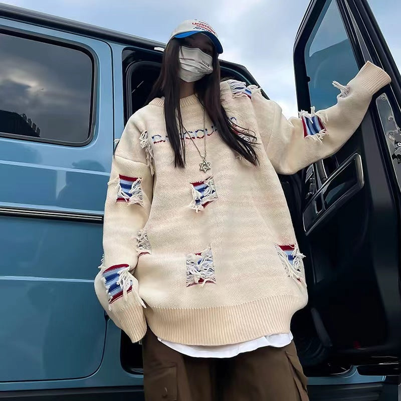 Urban knit pullover for women with unique ribbed details and a chic worn design