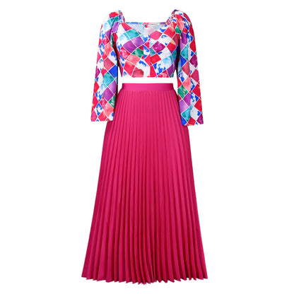 Robe combinée plissée pour dames avec un haut coloré et une jupe évasée Chic und Stil