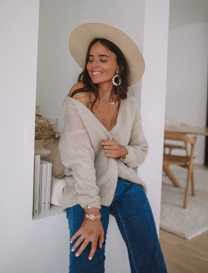 Pull léger pour femmes avec épaule dénudée et motif tricot doux Chic und Stil