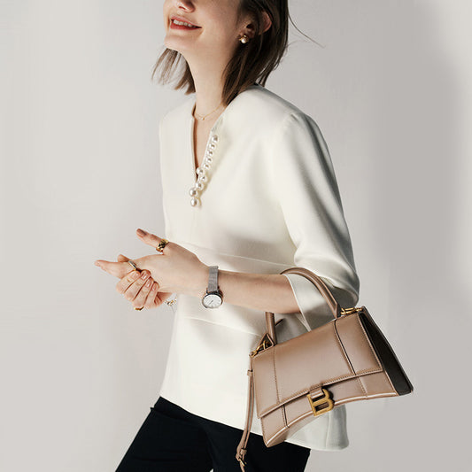 Blouse texturée élégante pour femmes avec détail de bouton décoratif Chic und Stil
