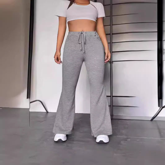 Sporty flared jogger pants for women with elastic waistband and practical pockets Chic and Style