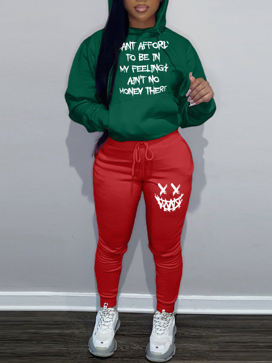 Casual women’s outfit with hoodie and jogger pants, featuring unique writing and creative patterns Chic and Style