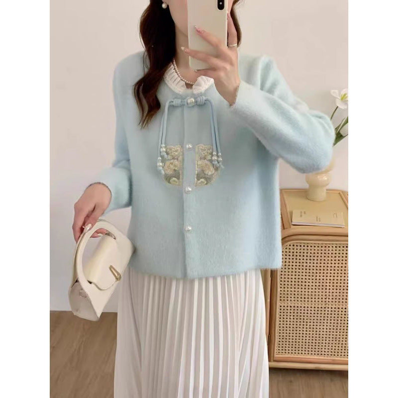 Pull à tricoter luxueux pour femmes avec détails de boutons décoratifs et volants Chic und Stil