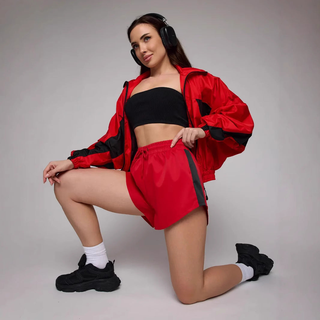 Women's athletic workout clothing with a highly functional jacket and chic stylish shorts