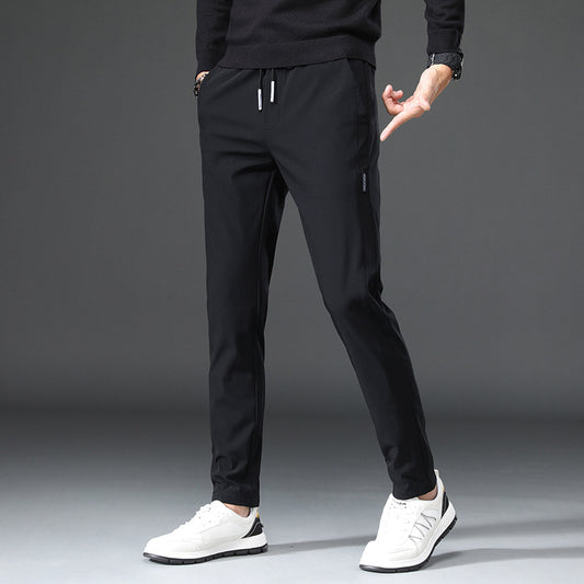 Men's slim fit sports pants with elastic waistband and practical zip pockets Chic and Style