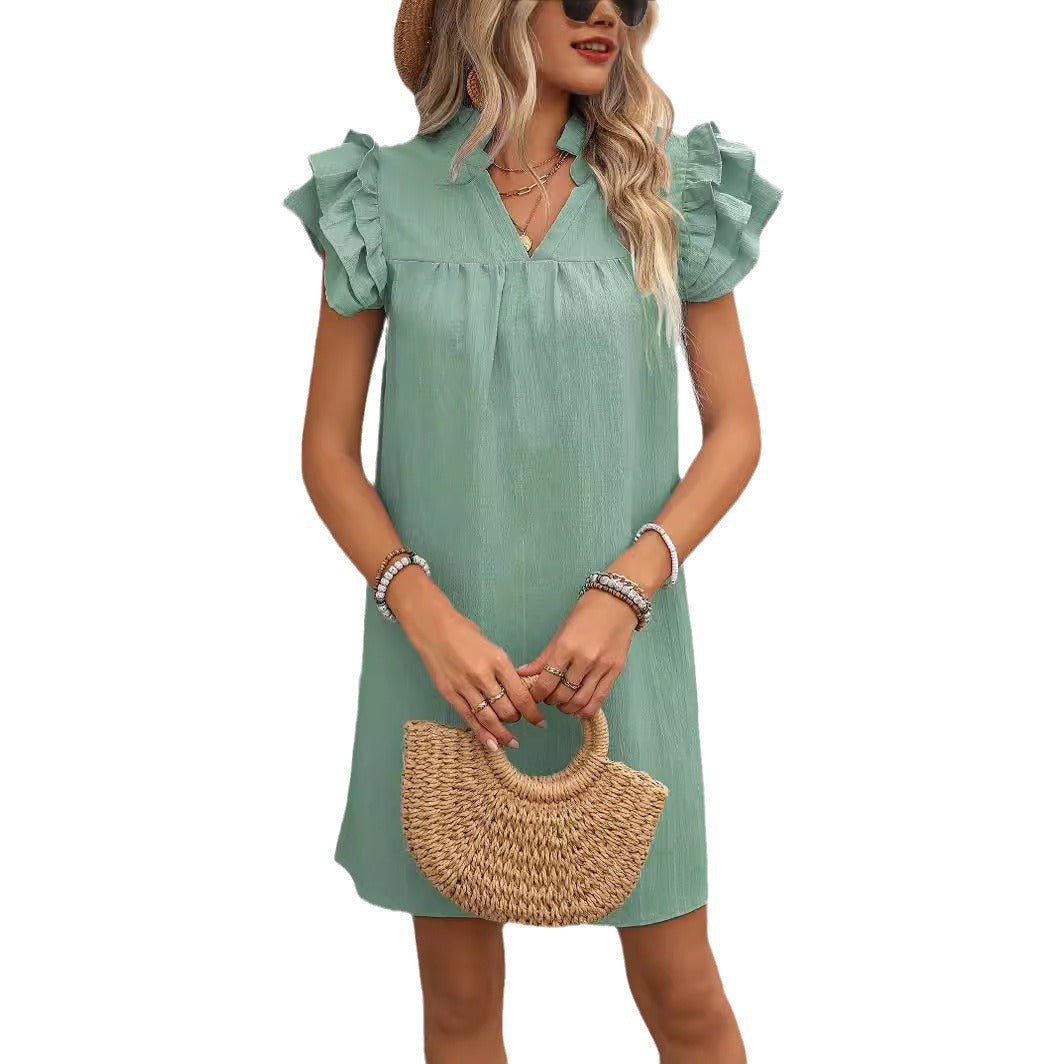 Robe élégante à manches courtes pour dames avec des détails en volants et décolleté en V Chic und Stil