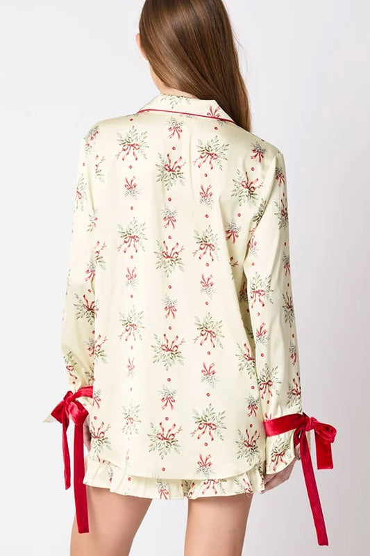 Chic und Stil | Christmas Fashion Printed Bow Tie Top and Elastic Waist Ruffled Shorts Set