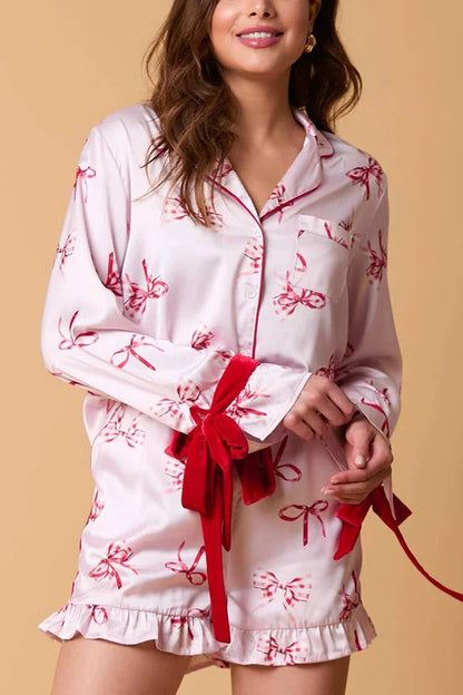 Chic und Stil | Christmas Fashion Printed Bow Tie Top and Elastic Waist Ruffled Shorts Set