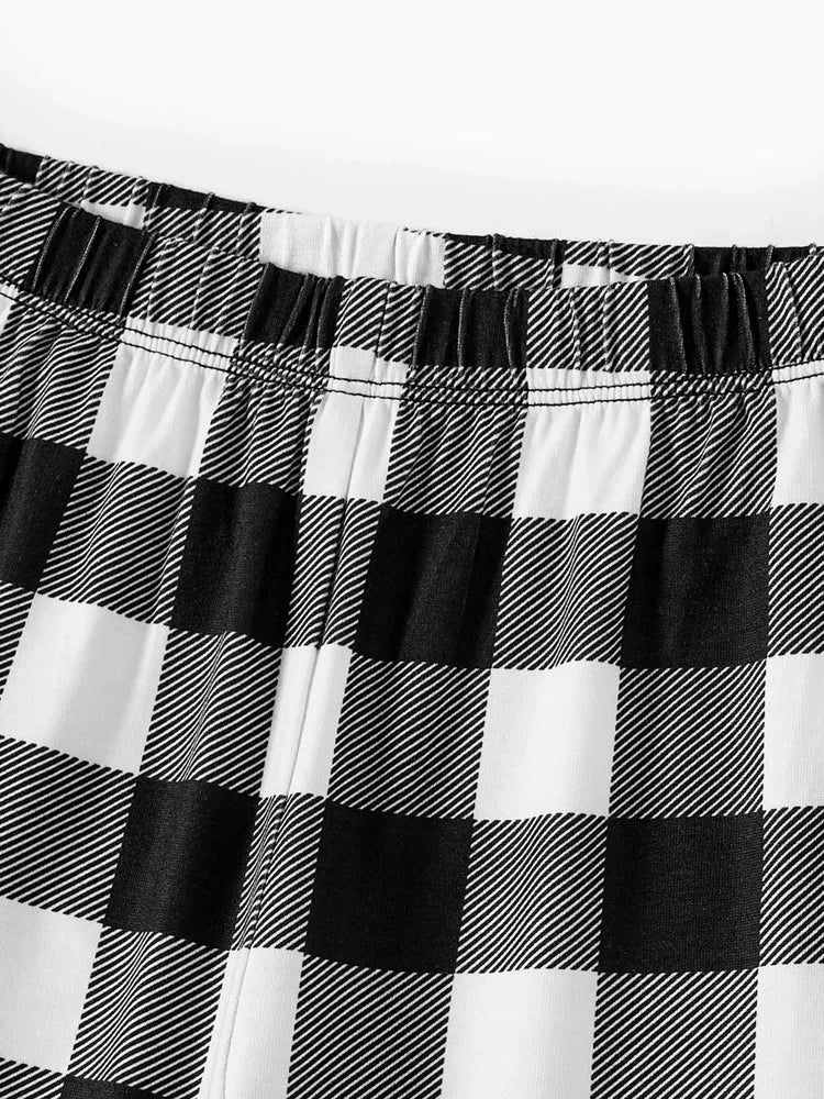 Chic und Stil | "Family Christmas 2025" Text and Deer Print Black Long Sleeve Top with Black and White Checked Pants Family Matching Pajamas