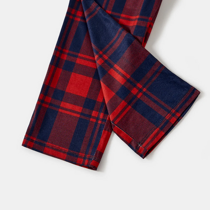 Chic und Stil | "2025 Christmas" Text and Santa hat print Blue Long-sleeved top with Red and Blue checkered pants Christmas pajamas in matching design